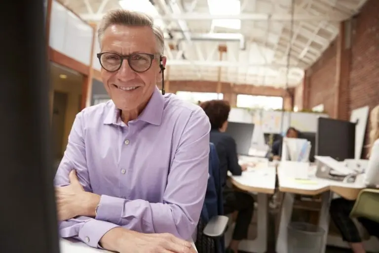 happy worker at desk