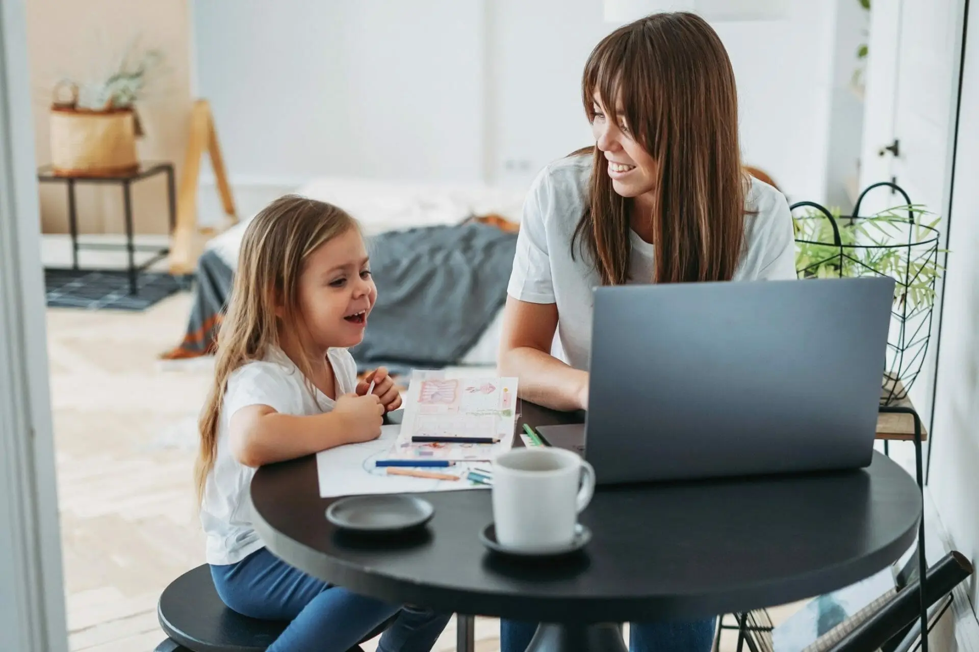 mom and daughter working from home