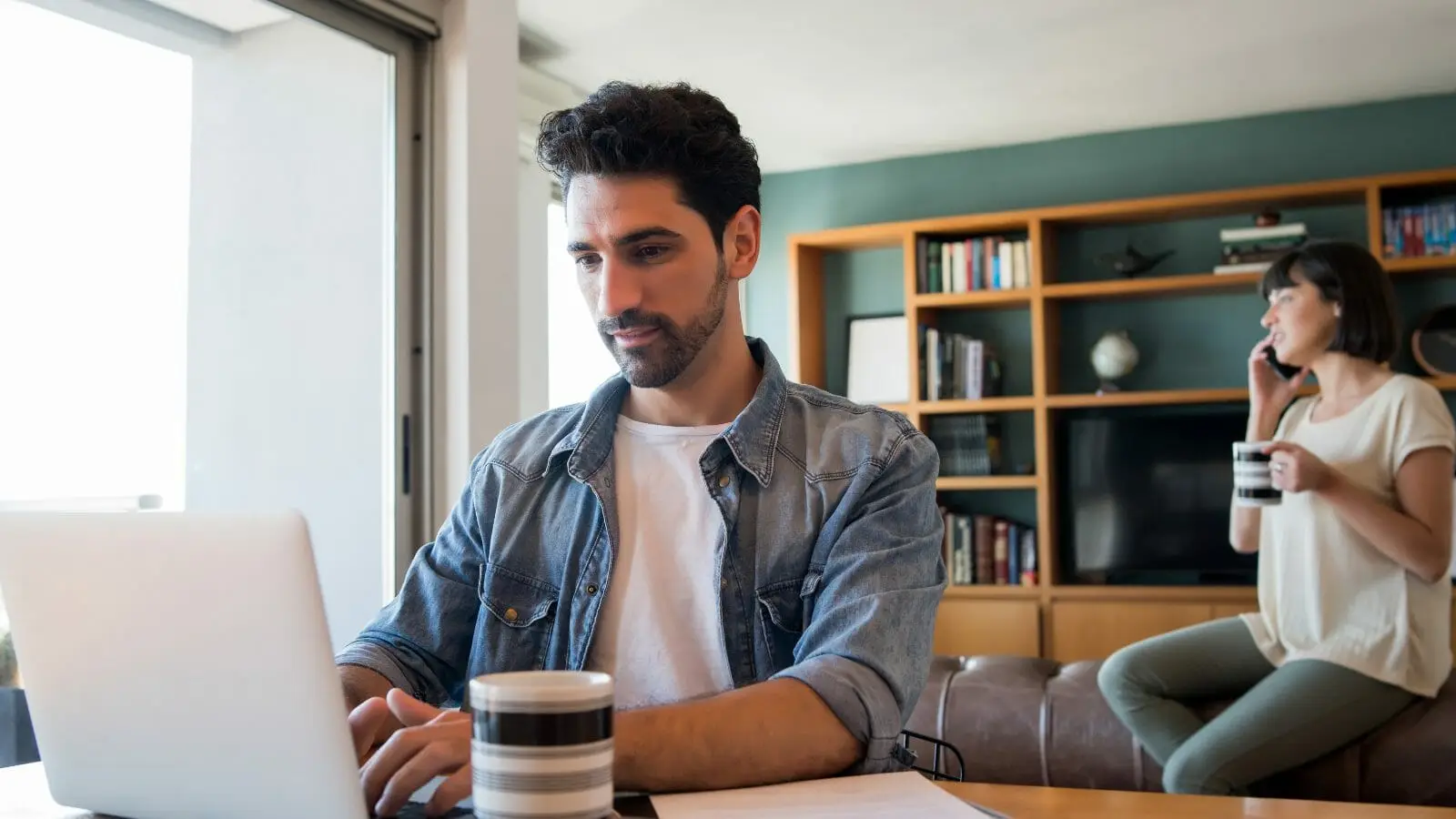 man using VoIP for a hybrid workplace