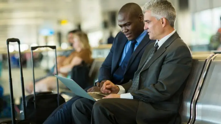 men using a laptop for unified communication benefits