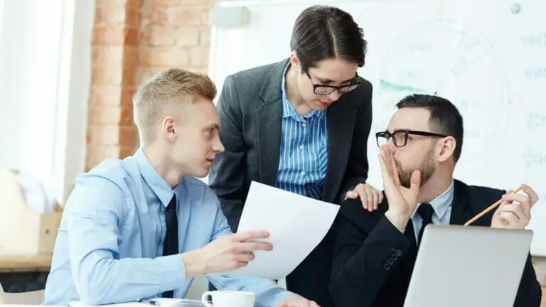 3 coworkers talking in secrecy about cloud-based telephone service